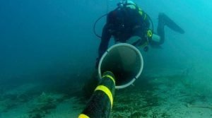 Diver examining a Subsea Communications Cable